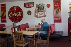 Dan's Ol' Time Diner decorates with vintage Coca Cola items in Oklahoma City, Tuesday, June 14, 2016. - EMMY VERDIN