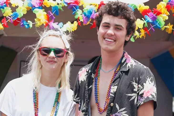 UCO students Chelsea Been, left, and Alex Cargo stand in front of the UCO SAFE table at the Pride Arts Festival on Saturday, June 24, 2017. (Cara Johnson).