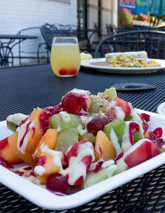 fruit salad(seasonal fruit and berries topped with anglaise sauce and raspberry sauce and garnished with chopped walnuts, served with a cafe comlette. Best of latin restaurant 2015. Taken in Oklahoma City, Thursday, August 6, 2015. - KEATON DRAPER