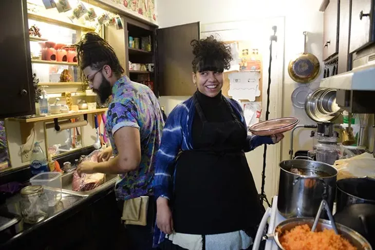 Cidward St Cler and her husband Shraz Mercier cook tamales in their kitchen, Tuesday, March 21, 2017. - GARETT FISBECK