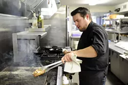 Chef Paul Langer works in the kitchen at Guernsey Park in Oklahoma City, Monday, Jan. 4, 2016. - GARETT FISBECK