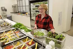 Beth Ann Lyon preps some fresh greens at Provision Kitchen, Wednesday, Jan. 11, 2017. - GARETT FISBECK