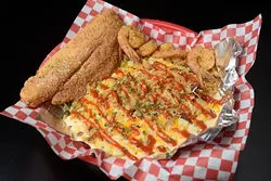 Super smothered seafood rice at Off the Hook, Tuesday, Feb. 14, 2017. - GARETT FISBECK
