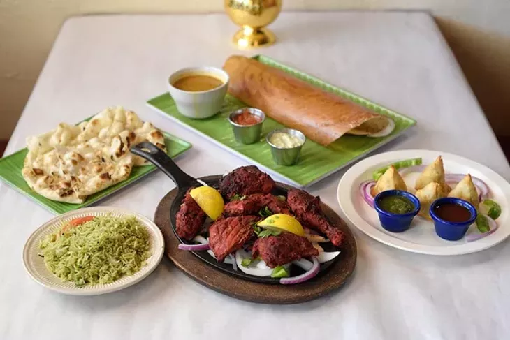 Tandoori chicken, ? - masala dosa, simosas, rice and naan at Himalaya's in Moore, Thursday, July 20, 2017. - GARETT FISBECK