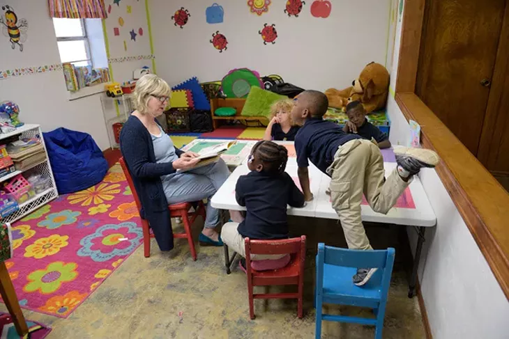 Bea Tunnell reads to a Pre-K class at Little Light Christian School, Thursday, March 2, 2017. - GARETT FISBECK