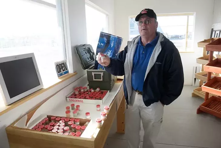Tilapia Garden Farms owner Russell Cox said he’s concentrating on raising more varieties of “superhot” chiles for customers this year. (Garett Fisbeck)