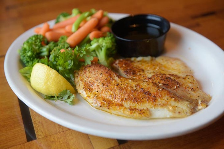 Tilapia and steamed vegetables at Pelican's in Midwest City, Tuesday, July 18, 2017. - GARETT FISBECK