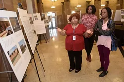 Tiffani Sanders talks about her participation with the Photovoice Project as Vanessa Morrison and Cheryl Sanders look on at the Oklahoma City Municipal Building, Tuesday, Jan. 24, 2017. - GARETT FISBECK