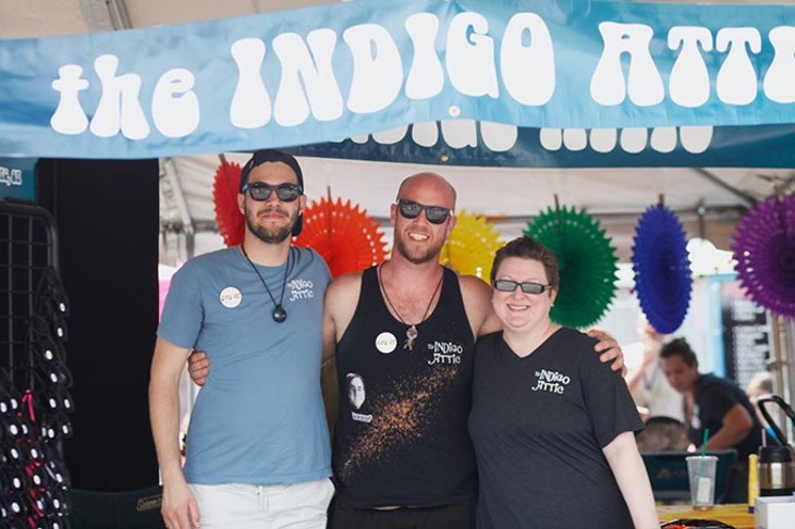 Susan Lawrence, owner of Indigo Attic in Oklahoma City, stands with staff members Aaron Riffa, left, and Matt Burdt. Indigo Attic had a booth at the Pride Art Festival on Saturday, June 24, 2017 handing out free sunglasses, pens, bracelets and coupons promoting their shop. (Cara Johnson).