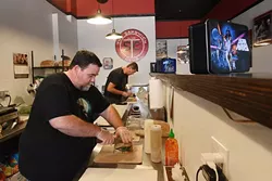 Isaac Barton and Alan Grande make sandwiches at the Sandwich Club, Monday, July 18, 2018. - GARETT FISBECK
