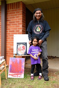 Richard Ray Whitman is teaching his 4-year-old granddaughter Seneca Pappan to paint. (Garett Fisbeck)