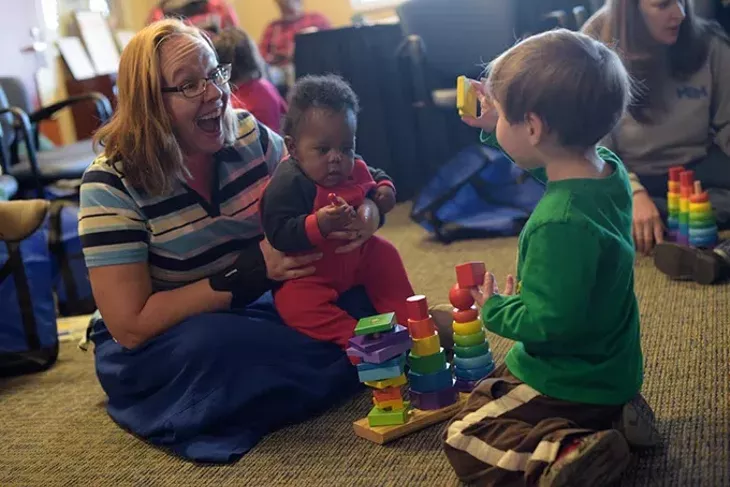 Colleen Wilcox plays with her son Luck, 2, and Elijah during an Early Bird class at Metro Career Academy, Friday, Feb. 3, 2017. - GARETT FISBECK