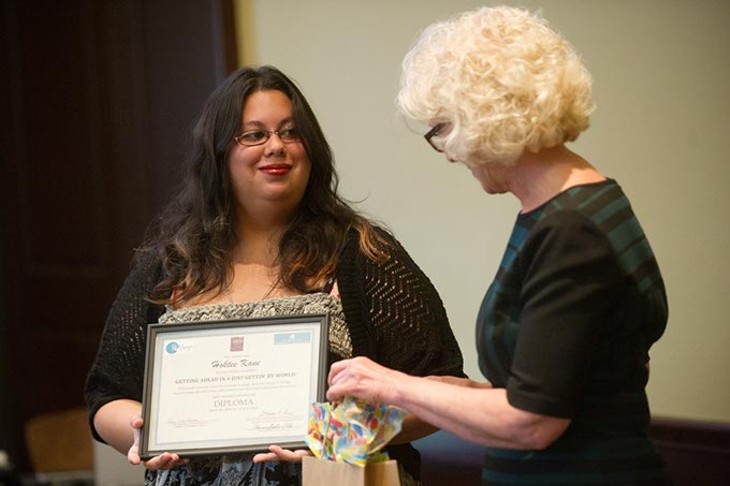 Deborah Price presents Hoktee Kane her diploma during a ReMerge graduation at the Oklahoma City Community Foundation, Thursday, June 30, 2016. - GARETT FISBECK