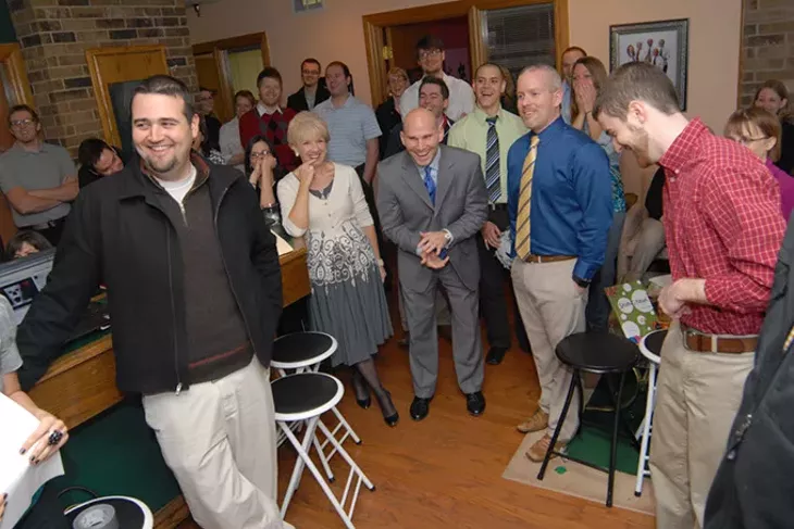Ryan Tate (center) with coworkers in 2008. (Gazette file)