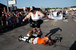 Twisted Armani jumps over Lita-Lita Ho' Beta and Princess Mayhem during 2015 OKC Pride Parade. OKC Pride’s theme for 2017 is “30 years of resistance.” The nonprofit organization is celebrating 30 years of Pride celebrations this year. - GARETT FISBECK / FILE
