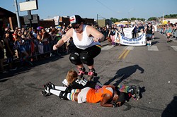 Twisted Armani jumps over Lita-Lita Ho' Beta and Princess Mayhem during 2015 OKC Pride Parade. OKC Pride&#146;s theme for 2017 is &#147;30 years of resistance.&#148; The nonprofit organization is celebrating 30 years of Pride celebrations this year. - GARETT FISBECK / FILE