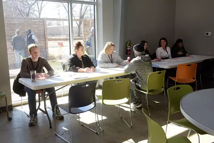 Volunteers conduct Point In Time surveys at the day shelter on the grounds of the WestTown Homeless Resource Campus in Oklahoma City. (Garett Fisbeck)