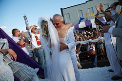 A couple gets married during the 2015 OKC Pride Parade. OKC Pride&#146;s theme for 2017 is &#147;30 years of resistance.&#148; The nonprofit organization is celebrating 30 years of Pride celebrations this year. - GARETT FISBECK / FILE