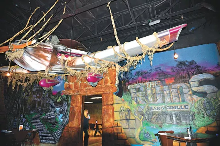 A giant plane hangs suspended in The Ruins Bar & Grille. (Photo Jacob Threadgill)