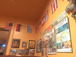 Flags from all of the countries represented on Zarate’s menu. (Photo Jacob Threadgill)