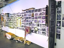 The Reclamation Re-Creation installation combines historic photos with artifacts from the building's history. | Photo Ben Luschen