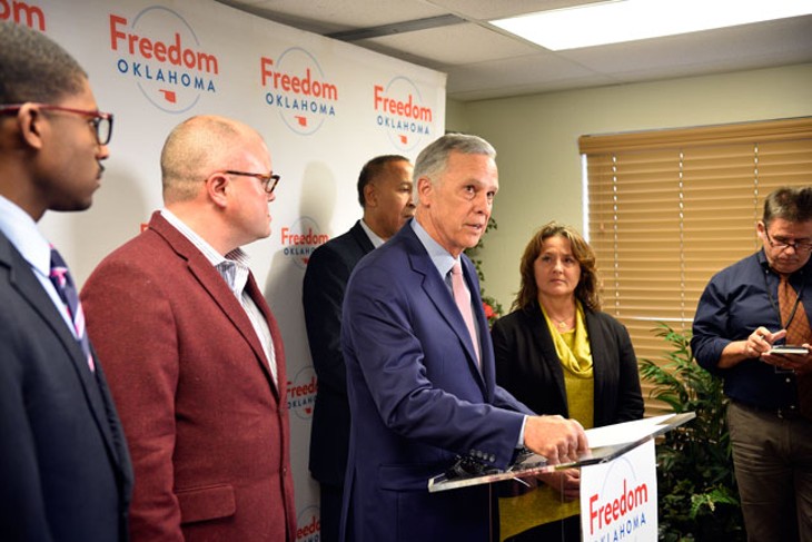 Kirk Humphreys stood at a podium and read a prepared statement apologizing for the remarks he made about gay men on Flashpoint. (Photo Laura Eastes )