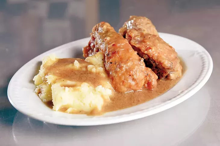 Smothered chicken and mashed potatoes at Florence's Restaurant in Oklahoma City, Thursday, March 3, 2016. (Garett Fisbeck) - GAZETTE / FILE