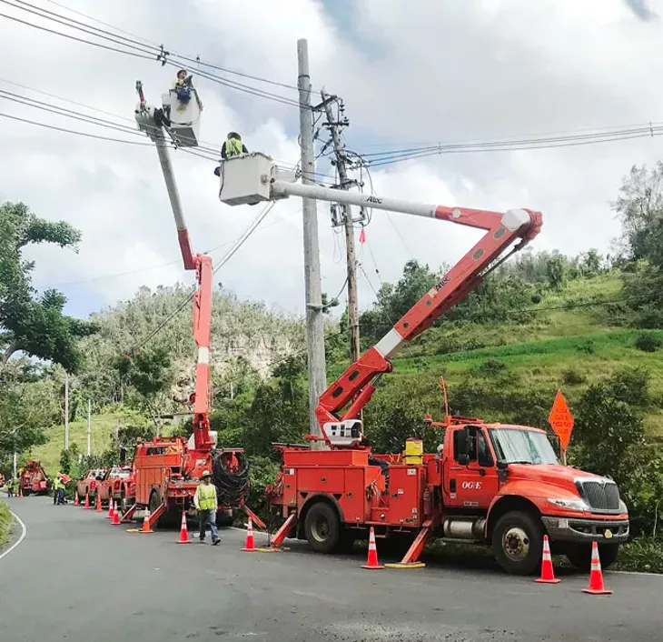 OG&E linemen work to restore power in Puerto Rico last month. (Photo provided)