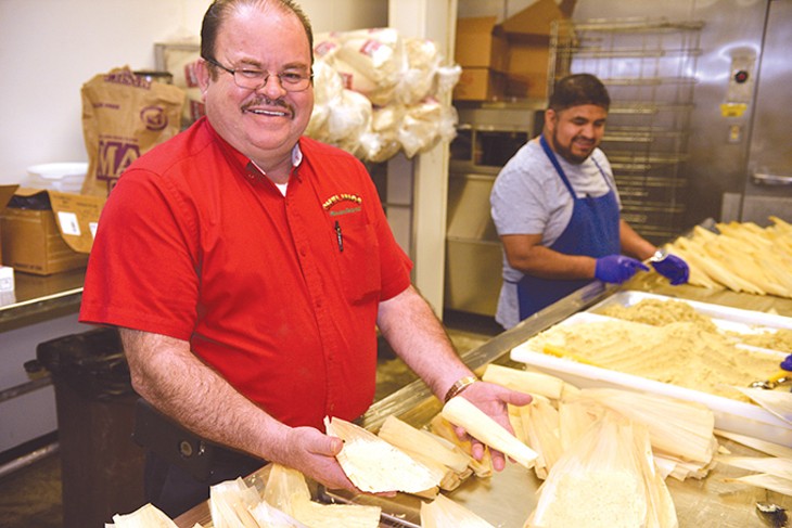 Marcelino Garcia shows off the new fresh tamale operation at Chelino’s tortilla factory at 2101 S. Robinson Ave. - JACOB THREADGILL