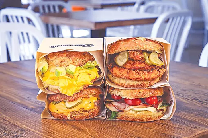 Four of the seven biscuit sandwiches on the menu at Buttermilk. - PROVIDED