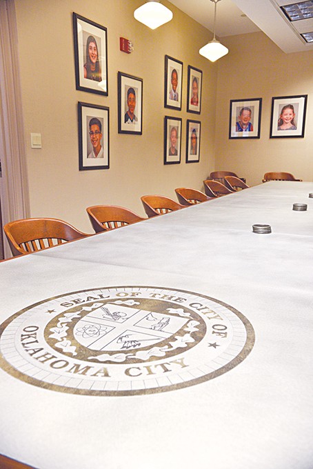 Inside the mayor’s conference room at Oklahoma City Hall, Mayor David Holt directed city staff to hang photos of the city’s children on the walls. Holt said he wants to remind leaders that they will make decisions that impact the next generation. - LAURA EASTES