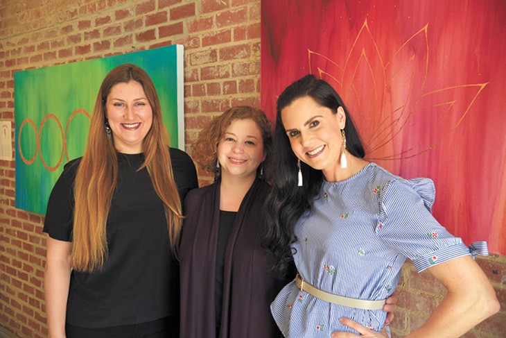 from left The Art Hall’s independent curator Helen Opper, OSSM art and history professor Kelly Chaves and gallery owner Anna Russell pose for a photo inside the Uptown 23rd District art space. - BEN LUSCHEN