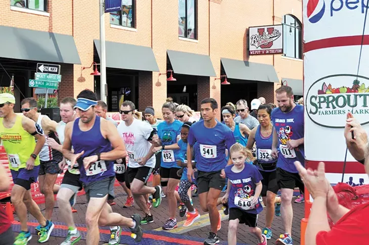 Runners at Autism Oklahoma’s PieceWalk cross the starting line at last year’s event. - PROVIDED