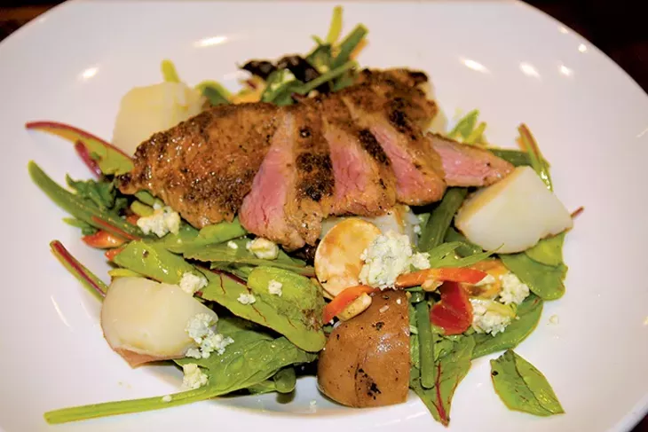 The lunch menu includes a steak salad tossed with champagne vinaigrette. - JACOB THREADGILL