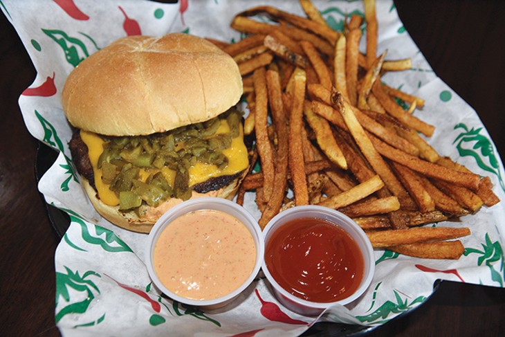 A fresh 1/3-pound burger topped with house-roasted Anaheim chiles and served with hand-cut fries. - JACOB THREADGIL