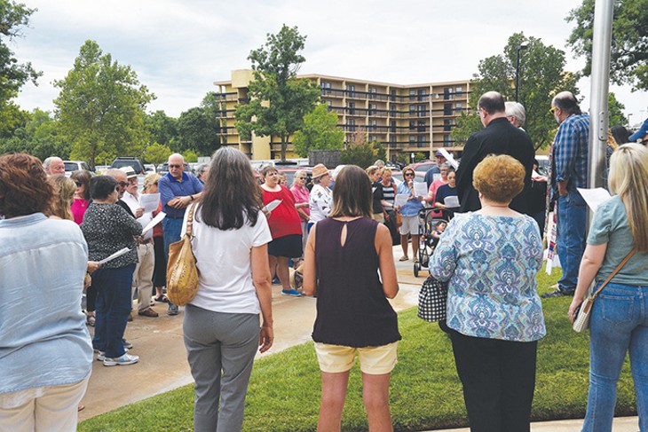 Dozens gather for the weekly Vigil for Immigration Justice, a multi-deonominational show of support for immigrant communities. Many vigil attendees voiced frustrations with the enforcement of family-separating policies on the nation’s southern border. - BEN LUSCHEN
