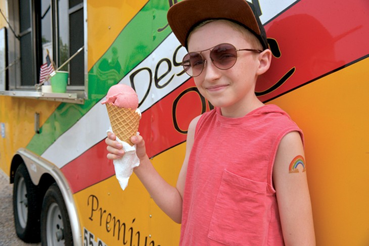 Blaine, 11, pauses before biting into a double scoop. - JACOB THREADGILL