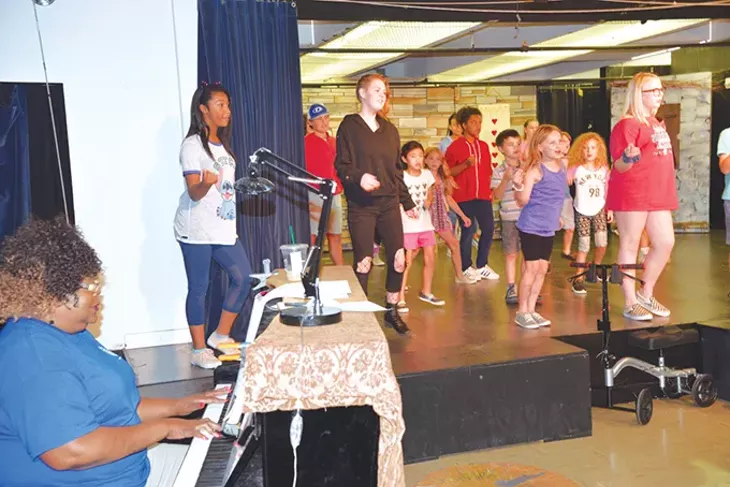 Musical director Bonita Franklin plays piano to “Ain’t No Mountain High Enough” for a production of The Frog Princess. - JACOB THREADGILL