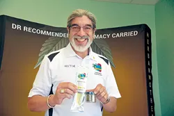 Hector Najar showcases his CBD oil products wearing his grandfather’s gold ring. - NAZARENE HARRIS