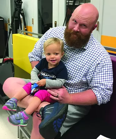 Kevin Hammond, a candidate for Cleveland County sheriff, and his 2-year-old daughter Rori attended Warren’s speech and talked to Oklahoma Gazette about students’ need for good healthcare in order to focus on their studies. - NAZARENE HARRIS