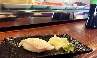 Sable nigiri is briefly touched by a blowtorch before hitting the rice at Tokyo Japanese Restaurant. - JACOB THREADGILL