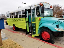 The Filling Tummies mobile food pantry is a brightly colored school bus that travels to schools, low-income apartment complexes, senior centers and afterschool programs offering free, fresh food. - PROVIDED