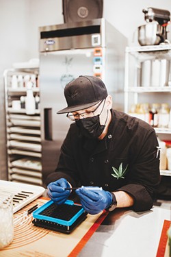 Fire Leaf recently hired cannabis chef Jeremy Cooper to organize its medical marijuana kitchen in its new Stockyards City location. - ALEXA ACE