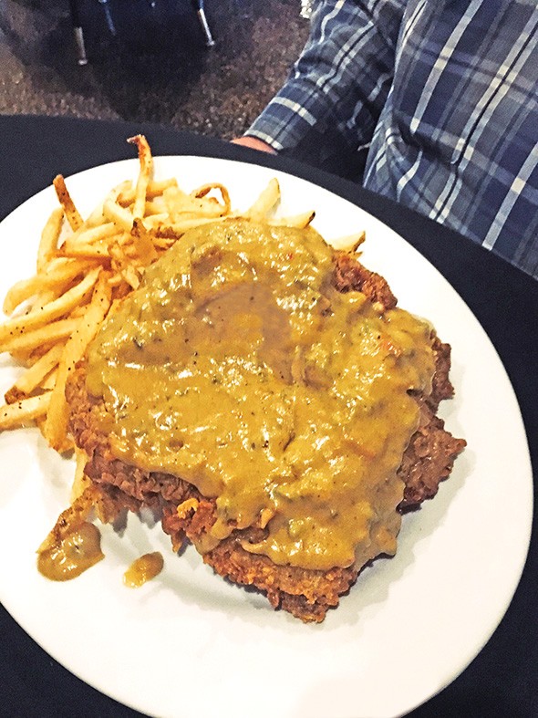 Chicken-fried steak with poblano gravy and fries - JACOB THREADGILL