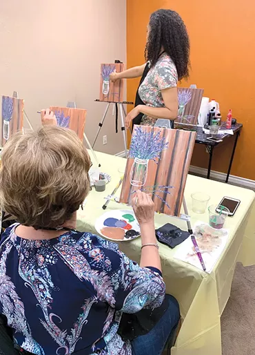 Erica Nkechi leads a paint party at her studios. - PROVIDED