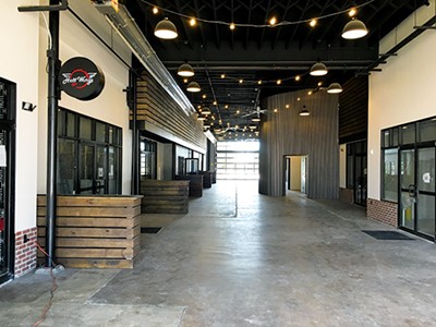 Hott Wings, a concept by the Eddie’s Bar & Grill owners, was the first restaurant to open in Edmond Railyard. - PETE BRZYCKI