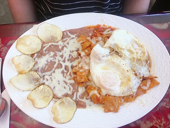Chilaquiles with eggs and red sauce - JACOB THREADGILL