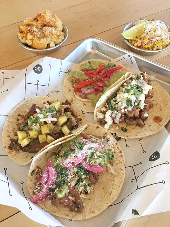 Al pastor, beer-can chicken, cotija and carne asada tacos with Nashville hot fried cauliflower and elote roasted corn at Social Capital - JACOB THREADGILL