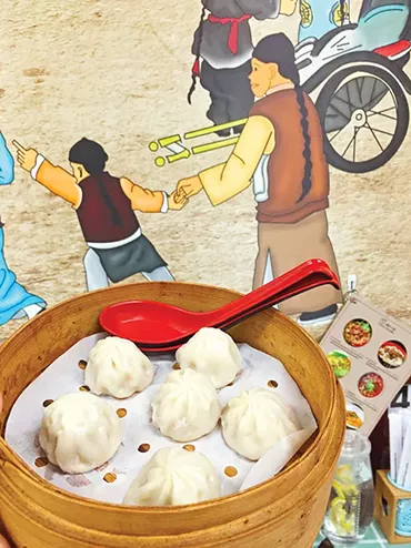 Soup dumplings are listed on the menu at Yummy Noodles as “little juicy pork buns.” - JACOB THREADGILL