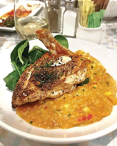 The salt-and-pepper chicken at Aurora with corn purée is on its new dinner menu. - JACOB THREADGILL